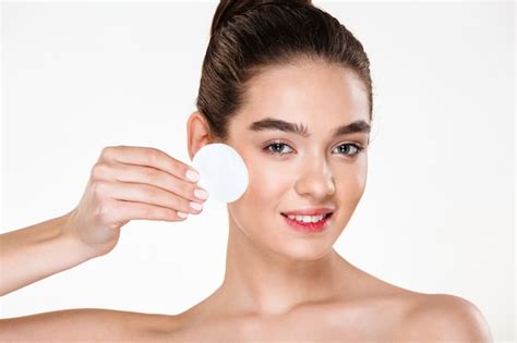 free photo close up beauty portrait of brunette attractive woman cleaning her face with cotton pad