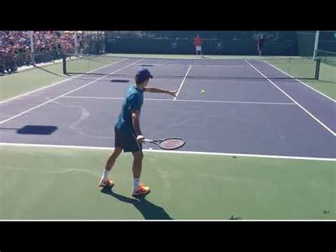 What separates federer's forehand from the rest of the pack is his this follow through is one where the racket swings across the body on the same side like the blades of a windshield wiper inside a car. Federer warm up slow motion forehand - YouTube