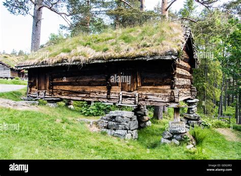 An Old House Standing On Stone Stilts At The Sunnmore Museum Norway