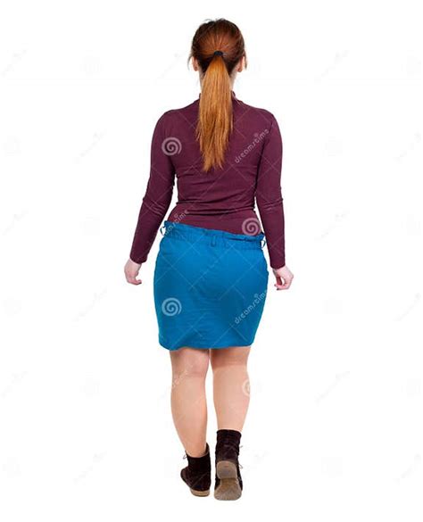 Back View Of Walking Woman Beautiful Blonde Girl In Motion Stock Image