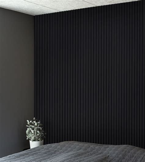 A Bedroom With Black Vertical Blinds On The Wall And A Plant Next To