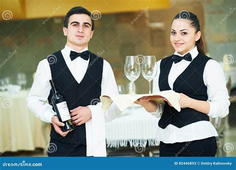 Young Waiter And Waitress At Service In Restaurant Stock Image Image