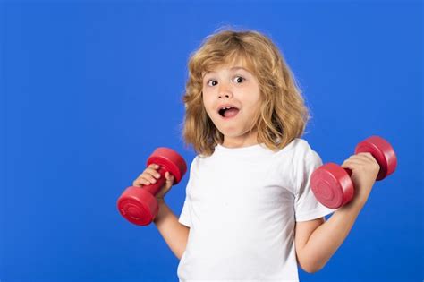 Premium Photo Child Workout Kid Sport Child Exercising With Dumbbells