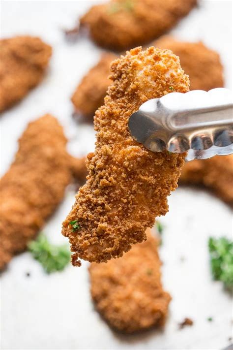 Crispy chicken tenders marinaded in buttermilk then fried (or oven baked!) golden brown are juicy and flavorful with southern seasonings. Baked chicken tenders | Recipe | Healthy chicken fingers ...