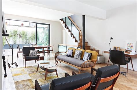 7 Design-Savvy Ideas for Open Floor Plans Transform an empty wall behind the dining table with cabinetry and a small countertop.