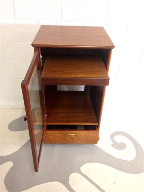 Maybe you would like to learn more about one of these? mid century modern stereo cabinet in teak with glass door ...