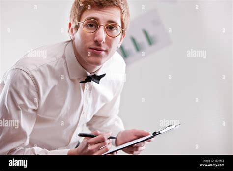 annoying redheaded clerk with glasses and a notepad asking more