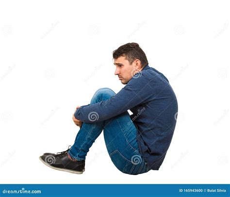 Full Length Side View Of Upset And Depressed Man Introvert Sitting