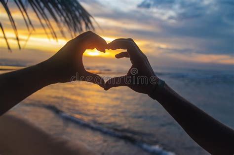 A Girl And A Man Make Hands A Heart At Sunset Sri Lanka Stock Photo
