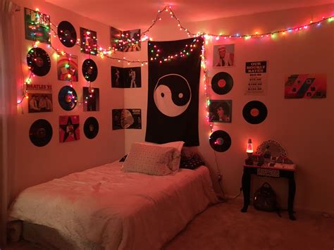 A Bedroom Decorated In Pink And Black With Lights On The Wall Pictures