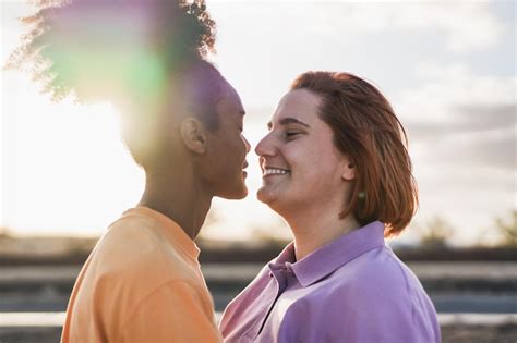Premium Photo Multiethnic Lesbian Couple Having Tender Moment At Sunset Outdoor