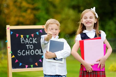 Two Adorable Little Schoolkids Feeling Excited About Going Back To