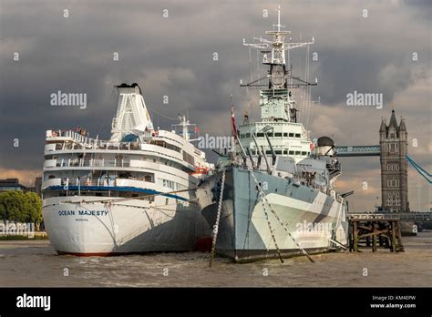 Hms Belfast With The Cruise Ship Mv Ocean Majesty Moored Along Side In
