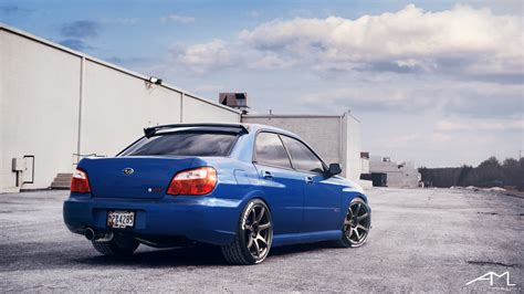 Blue Subaru Wrx Sti Boasting Custom Exhaust System — Gallery