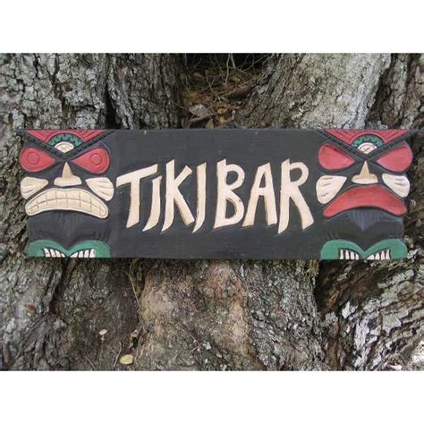 Tiki Bar Sign That Is Hand Made With Raised Letters And 2 Tikis On Each