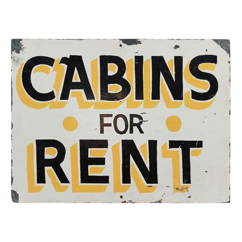 A Sign That Reads Cabins For Rent On Its Side With The Words Cabin