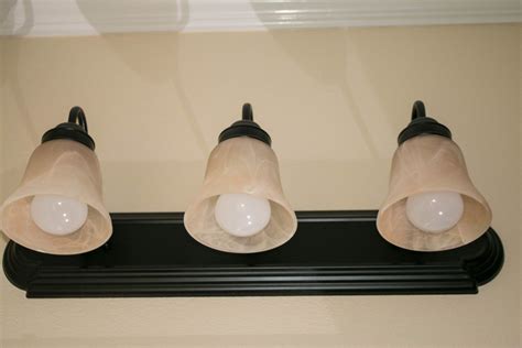 Whether you're looking for a complete bathroom remodel or just need some creative bathroom ideas, we've got you covered. Bathroom Light Fixture Redo - The Windswept Cowboy (With ...