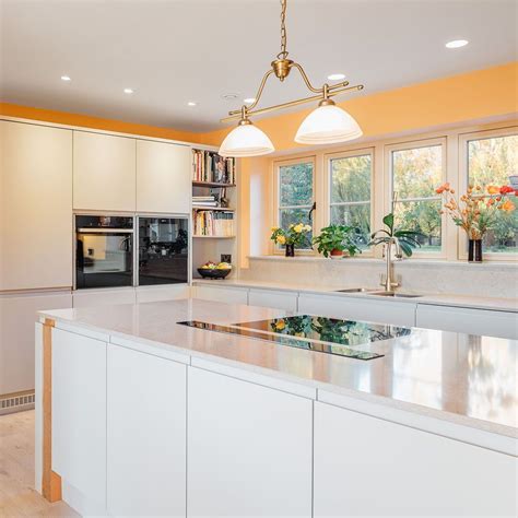 Many homeowners opt to build kitchen cabinets as part of their renovations in order to achieve a custom look without a huge price tag. Modern country kitchen, white units and timber beams. Building your own house. Building a house ...