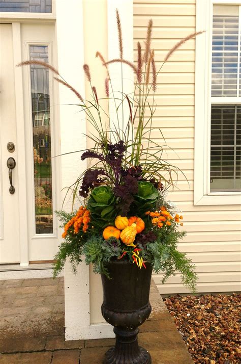 Fall Planter Using A Variety Of Kale Mums Grasses