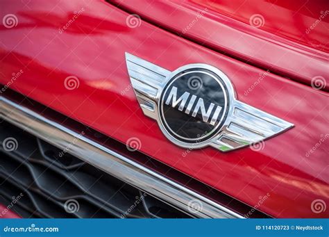 Retail Of Austin Mini Cooper Logo On Red Car Parked In The Street