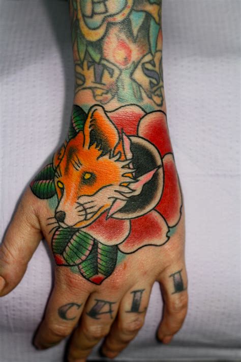 Ok, that was a terrible joke. Fox in rose tattoo on hand myke chambers | Tattoos by Myke ...