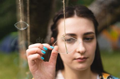 Portrait Of A Girl Holding A Glass Eye Hanging By A Thread Stock Image Image Of Nature