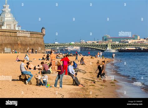St Petersburg People Sunbathing Along The Neva River Stock Photo Alamy