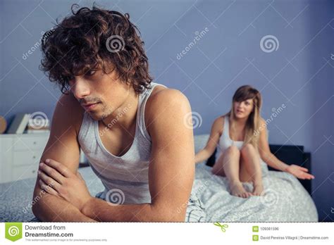Man Sitting Over Bed Listening To Woman In Quarrel Stock Photo Image