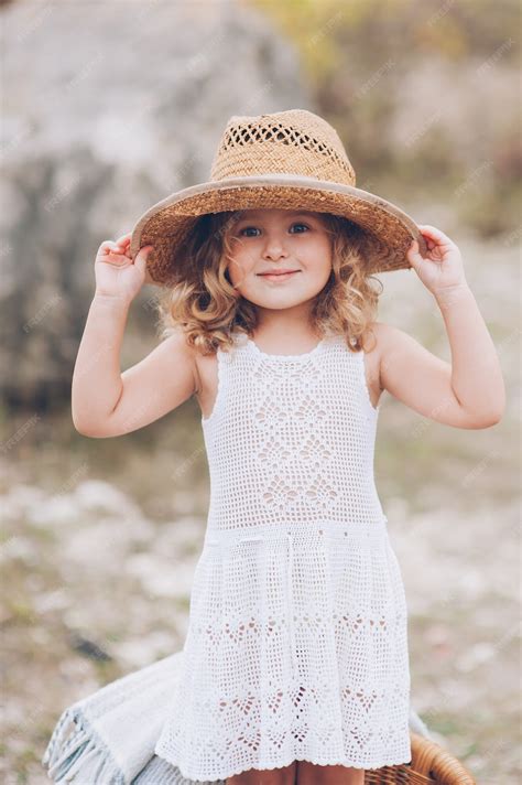 Premium Photo Happy Little Girl Wearing A Hat Outdoors