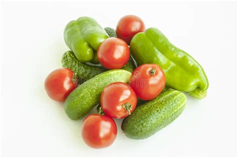 Vegetables Tomatoes Cucumbers And Pepper Green On A White Background
