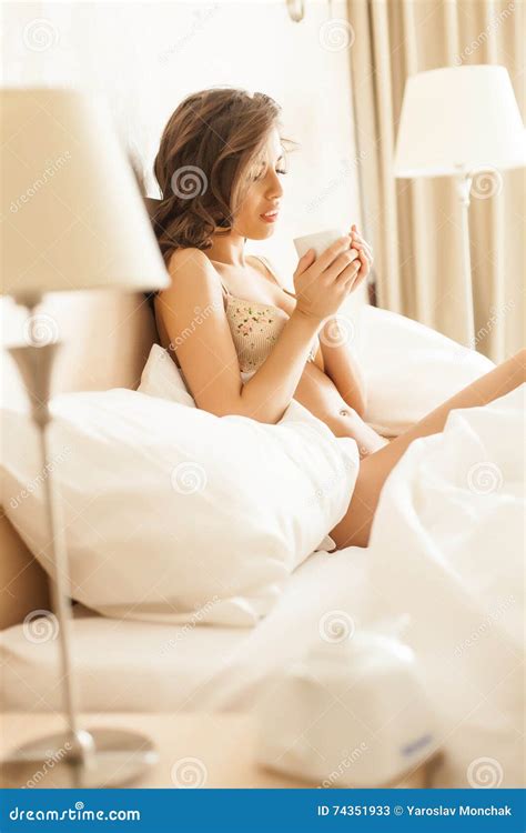 beautiful romantic woman brunette lying on the bed in her room at home stock image image of