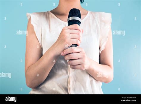 Woman Holding Microphone Stock Photo Alamy