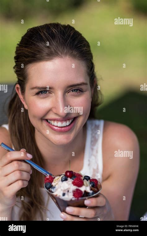 Portrait Of Woman Enjoying Dessert Stock Photo Alamy