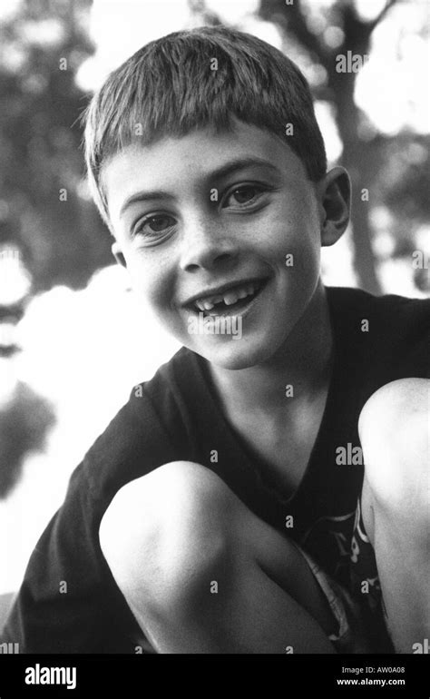 Black And White Image Of Smiling 10 Year Old Boy Stock Photo Alamy
