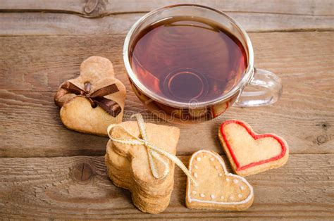 Cookies Hearts And A Cup Of Tea On Wooden Table Stock Photo Image Of