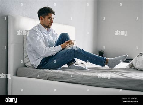 Sad Man Sitting On Bed Loneliness Depression Stock Photo Alamy