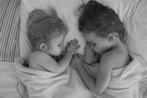 Little Sisters Sleep Together In Bed At Home Stock Image Image Of