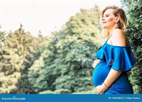 pregnant beautiful woman posing in the park stock image image of expecting outdoor 149018623