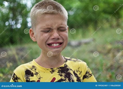 Caucasian Boy Crying Outdoors Alone Suffering Child Portrait Stock