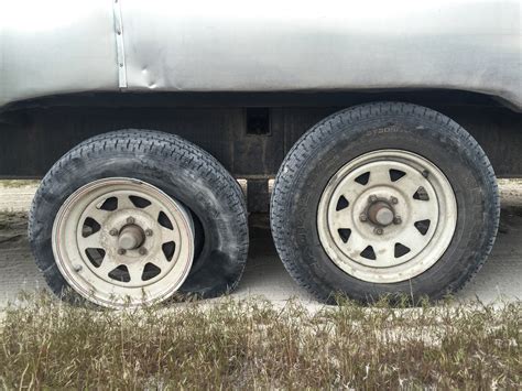 It was a flimsy little jack & it was the though i think this was a poorly placed jack combined with improperly removing tire while still touching the ground torquing yea, how would he get the tire off without something lifting the car. How To Change A Trailer Flat Tire Without A Jack — Live ...