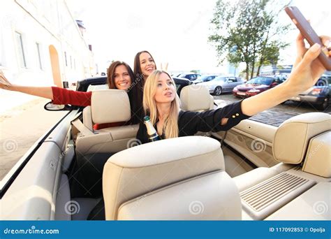 Group Of Girls Having Fun In The Car And Taking Selfies With Camera Stock Image Image Of Road