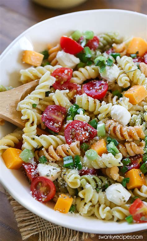 Squash the garlic cloves out of their skins and mush in a pestle and mortar. Easy Italian Pasta Salad - Swanky Recipes