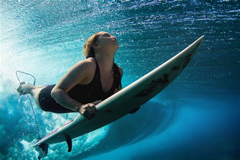 Female Surfers Beneath The Waves