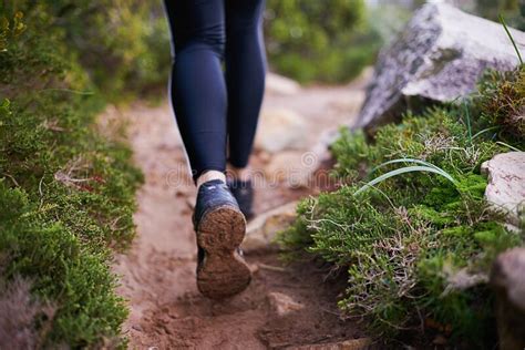 Hitting The Trail Closeup Shot Of The Legs Of A Woman Hiking A Long A