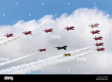 Royal Air Force Red Arrows Display Team In Formation With A Hawker