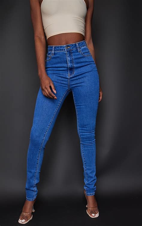 plt tall l36 mid blue wash 5 pocket skinny jeans prettylittlething