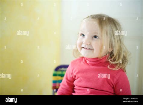 Blonde Toddler Girl Smiling Looking Up Stock Photo Alamy