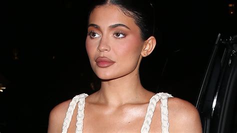 kylie jenner nearly suffers major nsfw wardrobe malfunction as she spills out of low plunging