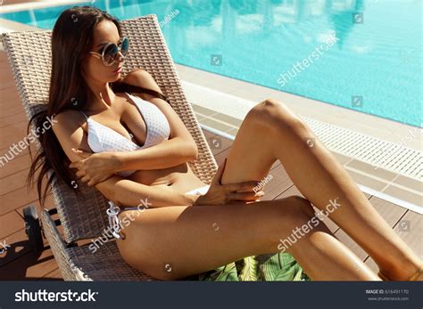 Sexy Woman Bikini Sunbathing Near Swimming Stock Photo