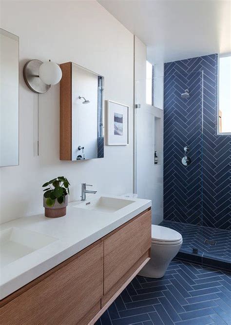 Dark colored bathroom tiles are not good for small bathroom tile designs because they make the space appear smaller. 97 Cool Blue Bathroom Design Ideas - DigsDigs